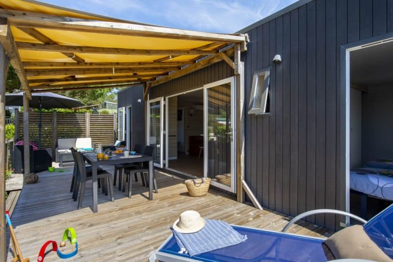 Wooden deck with modern outdoor furniture.